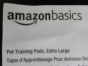 lot 54 image: Amazon Basics box of 50 Pet Trainin...
