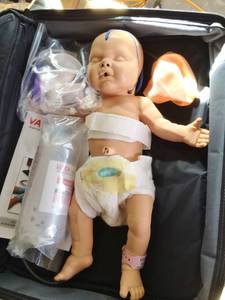 lot 23 image: MSRP $800&nbspNita Newborn  1800 Anatomically Correct Training Model of a 4 lb., 16 Newborn Female Baby - Great Condition - Comes With Everything in Pictures Including Carrying Case