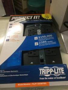lot 57 image: New In Package Tripp-Lite Power Supply Strip & Used Respironics Base
