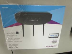 lot 26 image: NetGear WiFi Router...