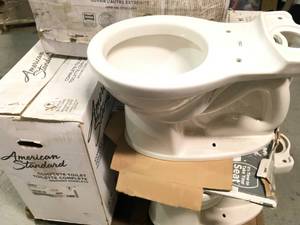 lot 2 image: PALLET WITH AMERICAN STANDARD TOILETS CUSTOMER RETURNS SEE PICS
