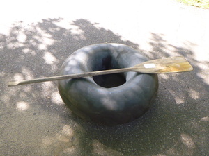 lot 56 image: Black Inner Tube and Oar