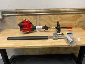 lot 35 image: TROY-BILT 22 in. 25 cc Gas 2-Cycle Articulating Hedge Trimmer with Attachment Capabilities