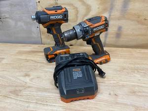 lot 56 image: RIGID Lot of 2 Tools.  A Drill and an Impact Driver with Charger and Battery