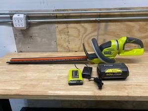lot 73 image: RYOBI 24 in. 40-Volt Lithium-Ion Cordless Battery Hedge Trimmer with Battery and Charger