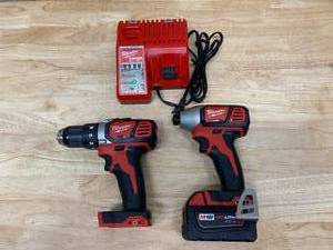 lot 81 image: MILWAUKEE Lot of 4 Items.  DrillDriver (12), Impact Driver (14 Hex), Charger M12 M18 and 18v Battery