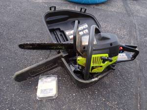 lot 79 image: Pouland Model P3416 Chain Saw with Case and Extra Chains