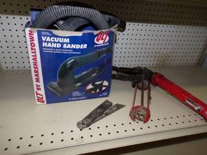 lot 94 image: Vacuum Hand Sander, pair of caulking guns and Corner measurer