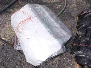 lot 134 image: Large Gray Tarp may have holes good for woodpile
