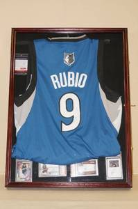 lot 65 image: Framed Ricky Rubio Signed Jersey with Cards