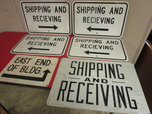 lot 239 image: SHIPPING AND RECEIVING SIGNS, EAST END OF BLDG. SIGN
