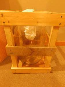 lot 113 image: Crate with Glass Bottle