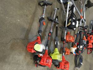 PALLET WITH ECHORYOBI & HOMELITE STRAIGHT AND CURVED TRIMMERS & CHAINSAWS CUSTOMER RETURNS SEE PICS