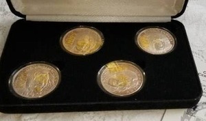 lot 12 image: KISS World Tour Commemorative .999 Silver Coins