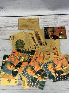 lot 85 image: Donald Trump 24kt Gold Plated Playing Cards