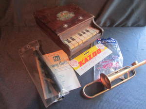 lot 41 image: Doll Piano, Conn Flute, Kazoo