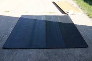lot 13 image: Roll top GMC Truck Bed Cover.
