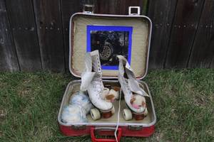 lot 40 image: Vintage roller skates and carrying case