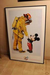 lot 74 image: Framed Mickey Mouse and fireman poster