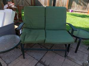 lot 104 image: Rocking outdoor love seat and glass end tables