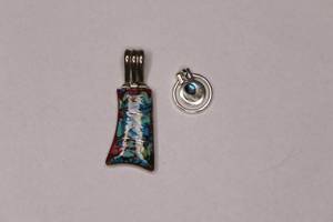 lot 414 image: Pair of abstract sterling necklace pendants