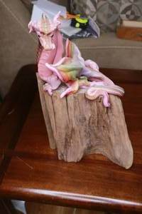 lot 415 image: Wax dragon sculpture on wood stump