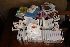 lot 387 image: Vintageearly 80s playing cards, College, Super Bowl, Pro Bowl, Cigarette, Beer,Liquor, Arcade Games, Star Trek, Race Car, State, City, Misc. All new, NeverOpened 
