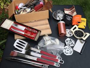 lot 134 image: Pampered Chef cookie scoops, Barbeque cooking utensils, Cooke cutter kit, Wood cutting board, Maxam knives, (never used), Spatulas, Whisks, Cheese cutters, Strawberry pit remover, misc. items