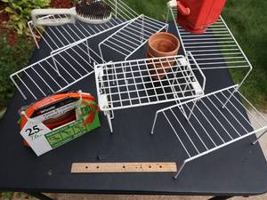 lot 127 image: &nbspElectric Cord, 6 Outlet lawn stake, Grass seed and Spreader, Wire Shelving, Misc. items
