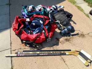 lot 514 image: Adult Hockey Gear, Sticks, and Mens size 8 Bauer hockey skates, (skates only used a handful of times in old mens league)