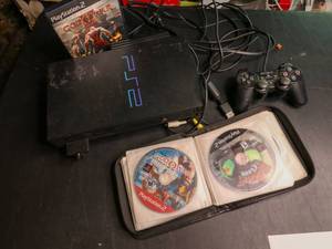lot 457 image: Playstation 2 with controller and games