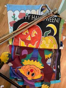 lot 471 image: 24 Holiday and assorted flags, (will cover you for all 12 months), and 4 Wooden Flag Poles