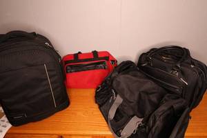 lot 201 image: One large duffel bag 24 wide, one small duffel bag 16 wide plus rolling briefcase and rolling backpack