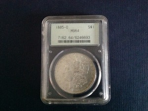 lot 46 image: 1885 O Morgan Dollar MS64