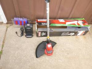 Craftsman 60 volt weed trimmer with battery & charger. Nearly new. Tested & works. As shown.