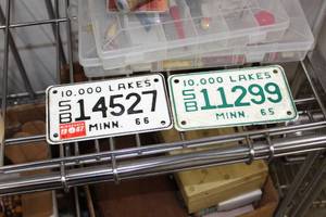 lot 214 image: Lot of (2) 19651967 Minnesota Vintage Cushman License Plates