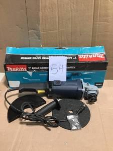 Makita 15 Amp 7 in. Corded Angle Grinder with Grinding wheel, Side handle and Wheel Guard&nbspin good condition