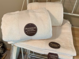 lot 201 image: Four Ivory Colored Bath Sheets
