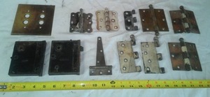 lot 9 image: Vintage Hinges, door latch mechanism, push button light switch cover.