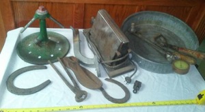 lot 88 image: Vintage metal tools, horseshoes & more.