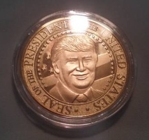 lot 148 image: Trump coin with presidential seal.
