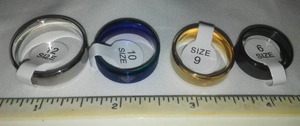 lot 178 image: 4 Superman Rings Size 12, 10, 9, 6