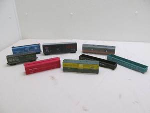 lot 94 image: Gondolas, box cars, passenger car, livestock car