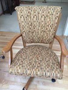 lot 65 image: Honey Oak Table And Four Rolling Padded Chairs