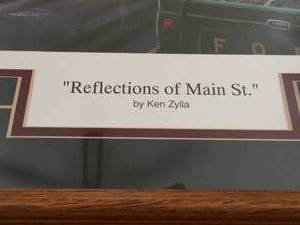 lot 89 image: Reflections of Main street Framed Art By Ken Zylla