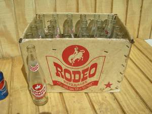 lot 23 image: Vintage Case Rodeo Pop Bottles
