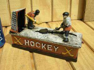 lot 96 image: Cast Iron Mechanical Hockey Bank
