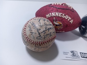 Two Commemorative Stamped Twins Signed Baseballs, 1991 Twins World Champions Mini Bat, 2011 Twins Opening Day Baseball, and Minnesota Vikings Candle