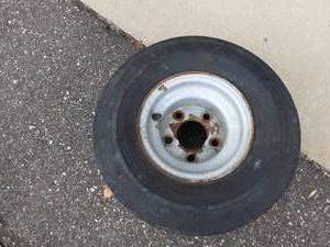 lot 80 image: Trailer Tire 18.5 X 8.5-8 On Wheel Holds Air