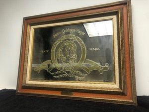 lot 75 image: Vintage 1970s Metro-Goldwyn-Mayer Hollywood Movie Studio 50th Anniversary Advertising Mirror